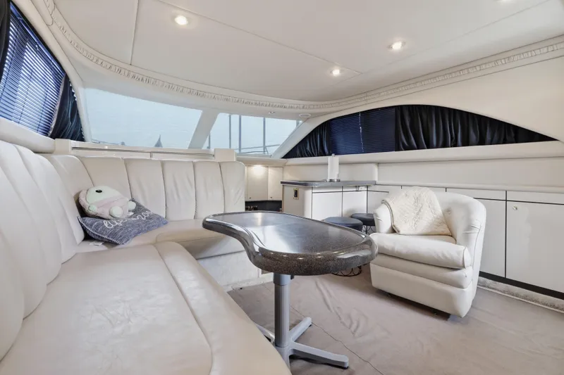 Slide: The Image of Luxurious interior of a 1997 Sea Ray 370 Aft Cabin yacht with plush seating and modern decor. - 26