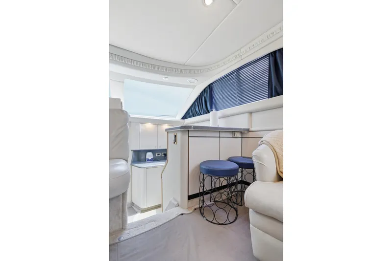 Slide: The Image of Interior of 1997 Sea Ray 370 Aft Cabin yacht with modern seating and cabinetry. - 29