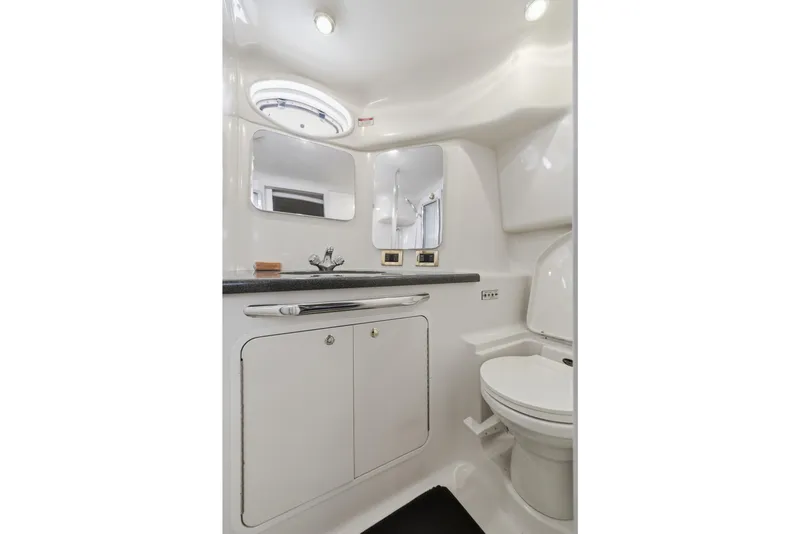 Slide: The Image of 1997 Sea Ray 370 Aft Cabin bathroom with modern fixtures and sleek design. - 40