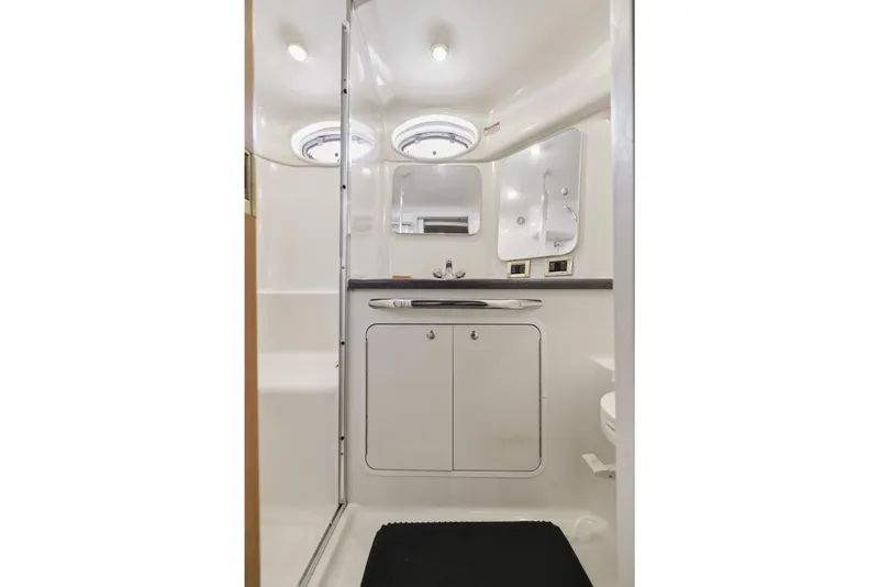 Slide: The Image of 1997 Sea Ray 370 Aft Cabin bathroom with modern fixtures and ample lighting. - 41