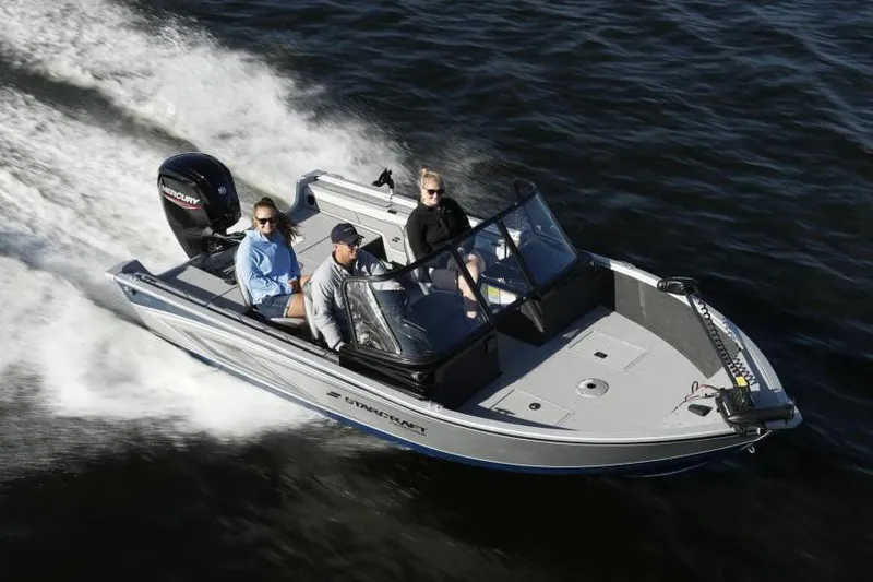 Slide: The Image of Manufacturer Provided Image: 2020 Starcraft Renegade 178 DC boat cruising on water with three passengers. - 11