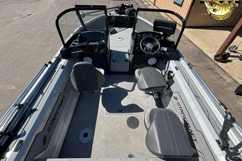 Slide: The Image of 2020 Starcraft Renegade 178 DC boat interior with seating and control panel. - 5
