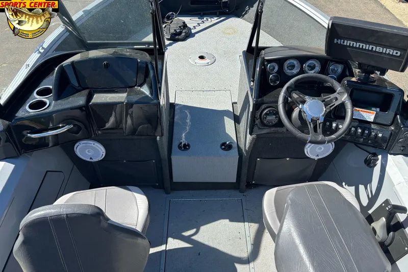 Slide: The Image of 2020 Starcraft Renegade 178 DC boat interior with steering wheel and dashboard controls. - 6