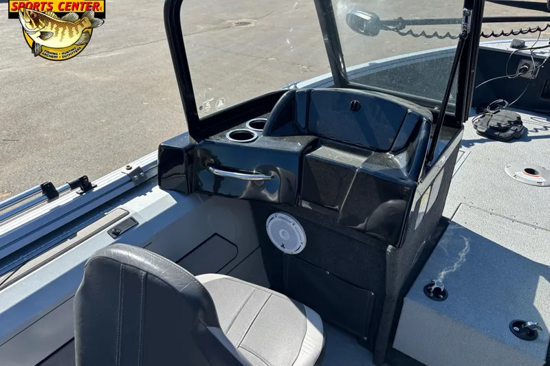 Slide: The Image of 2020 Starcraft Renegade 178 DC boat interior with steering console and seating. - 8