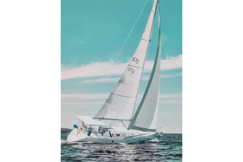 Slide: The Image of Sailing yacht Beneteau First 38s5, 1991 model, gliding on open water under clear skies. - 10