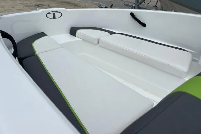 Slide: The Image of 2022 Tahoe T16 boat interior with white and green seating. - 10