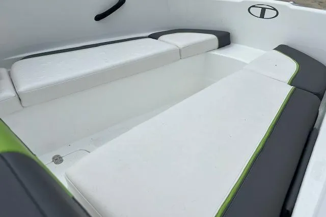 Slide: The Image of Interior seating of a 2022 Tahoe T16 boat with white and green accents. - 4
