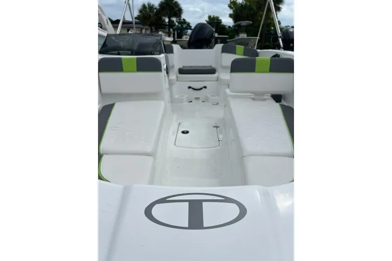 Slide: The Image of 2022 Tahoe T16 boat interior with white and green seating, showcasing spacious design. - 5