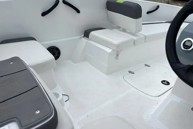 Slide: The Image of 2022 Tahoe T16 boat interior with white seating and modern design elements. - 7