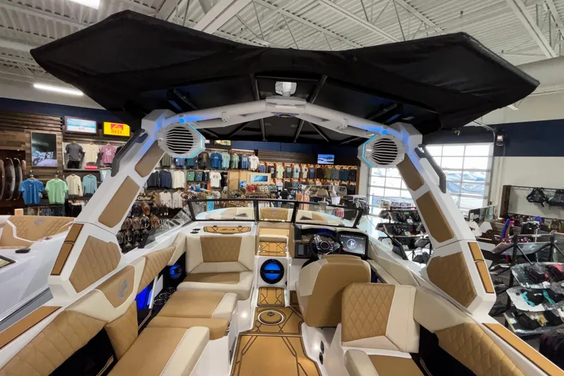 Slide: The Image of Interior of 2026 Tigé Z3 boat with luxury seating and advanced dashboard in showroom. - 13