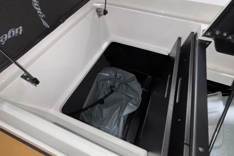 Slide: The Image of Storage compartment of 2026 Tigé Z3 boat with ballast bag and open hatch. - 18
