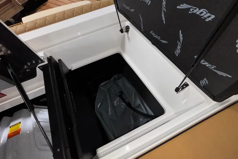 Slide: The Image of 2026 Tigé Z3 boat storage compartment with open hatch and visible interior. - 19