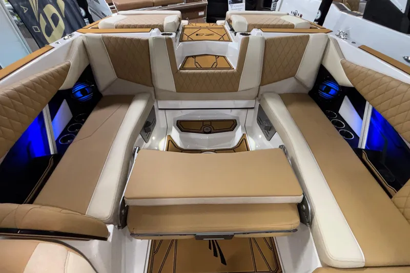 Slide: The Image of 2026 Tigé Z3 boat interior with luxurious tan seating and ambient blue lighting. - 20