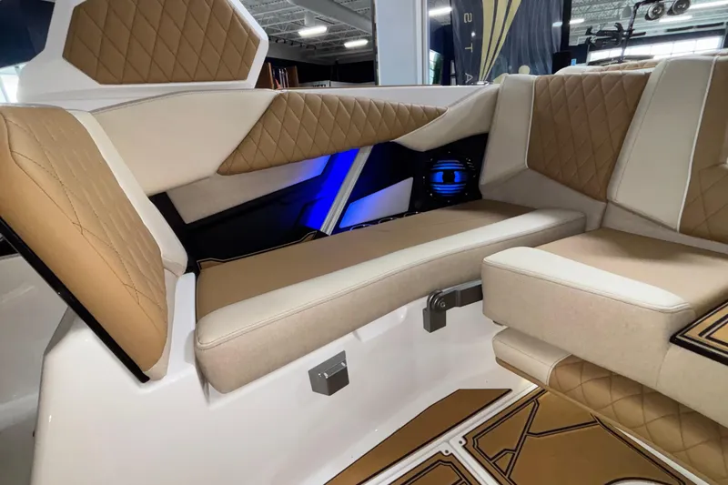 Slide: The Image of Luxurious interior of 2026 Tigé Z3 boat with tan and cream seating. - 23