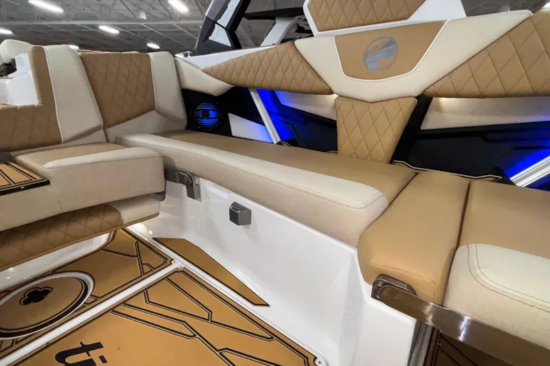 Slide: The Image of Luxurious interior of 2026 Tigé Z3 boat with tan and white seating. - 25