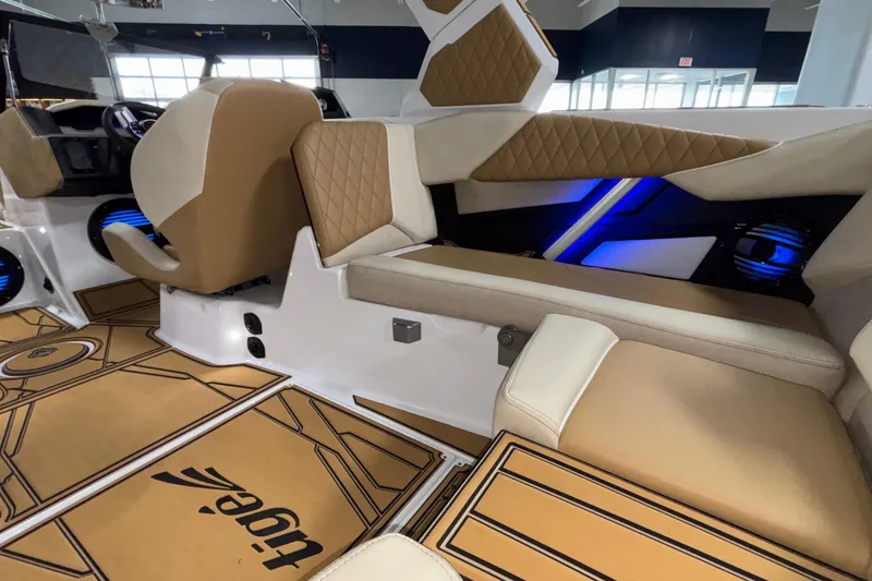 Slide: The Image of Interior of 2026 Tigé Z3 boat with tan seating and blue LED lighting. - 27