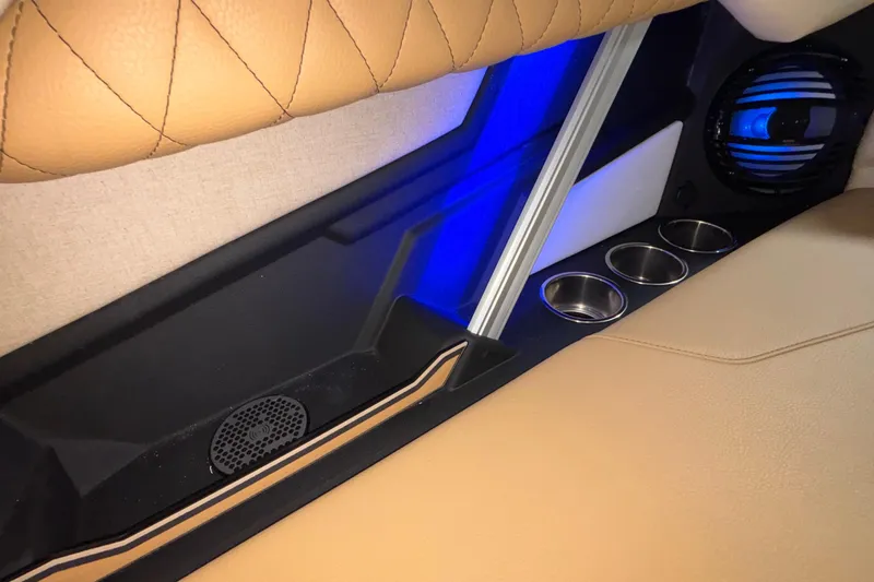 Slide: The Image of 2026 Tigé Z3 interior with beige leather seats, blue LED lighting, and cup holders. - 29