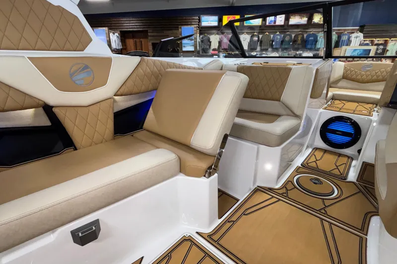 Slide: The Image of Luxurious interior of 2026 Tigé Z3 boat with tan and cream seating. - 30