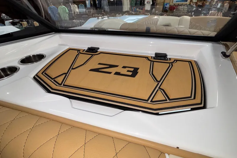 Slide: The Image of 2026 Tigé Z3 boat interior with stylish tan upholstery and cup holders. - 34