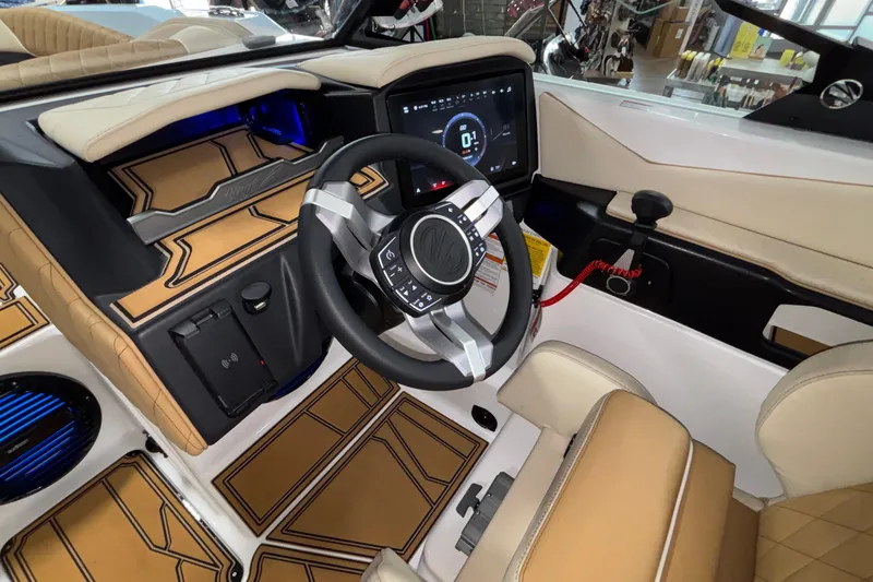 Slide: The Image of Interior of 2026 Tigé Z3 boat featuring modern dashboard and steering wheel design. - 36