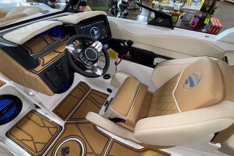 Slide: The Image of 2026 Tigé Z3 boat interior with luxurious tan seating and advanced dashboard controls. - 37