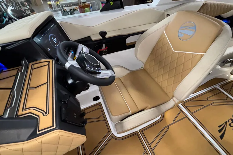 Slide: The Image of Luxurious interior of 2026 Tigé Z3 boat with tan leather seating and modern dashboard. - 38