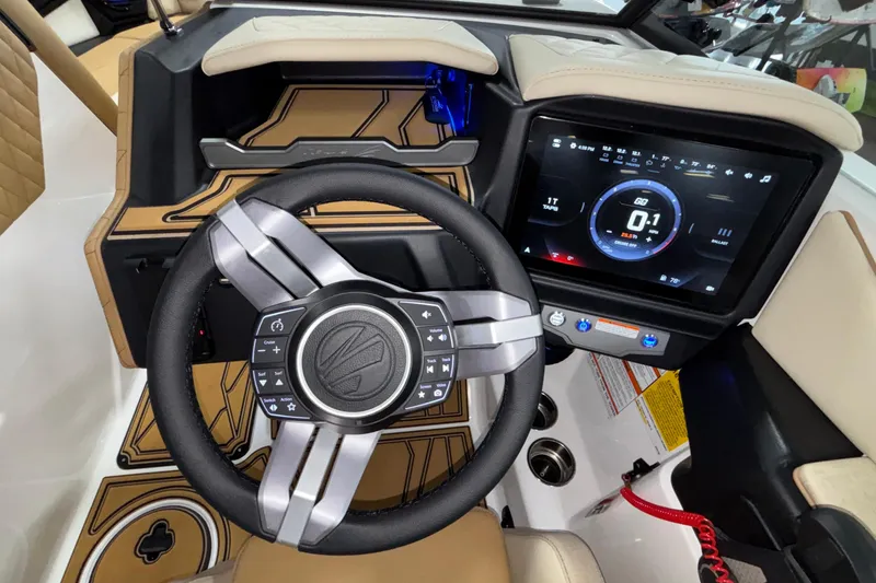Slide: The Image of 2026 Tigé Z3 boat dashboard with advanced touchscreen and modern steering wheel design. - 40