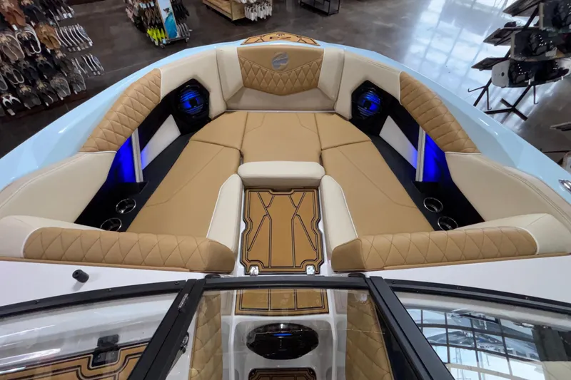 Slide: The Image of Luxurious interior of 2026 Tigé Z3 boat with tan seating and blue LED lighting. - 47