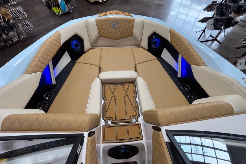Slide: The Image of Luxurious interior of 2026 Tigé Z3 boat with tan seating and blue LED lighting. - 49