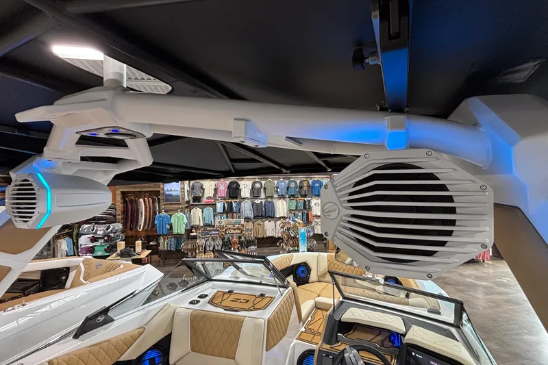 Slide: The Image of 2026 Tigé Z3 boat interior with speakers and luxury seating in a showroom. - 58