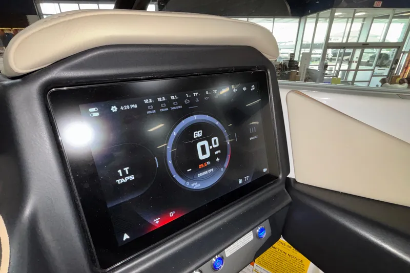 Slide: The Image of 2026 Tigé Z3 boat dashboard with digital display showing speed and controls. - 6