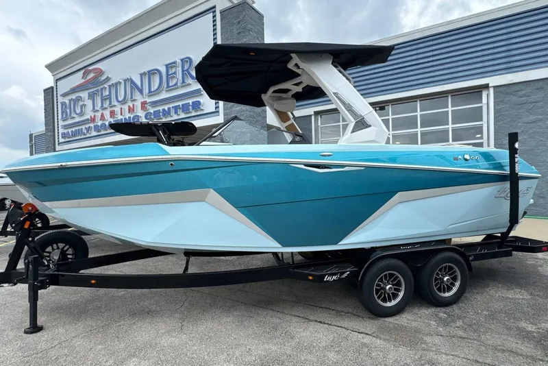 Slide: The Image of 2026 Tigé Z3 boat in vibrant blue at Big Thunder Marine, displayed on a trailer. - 60