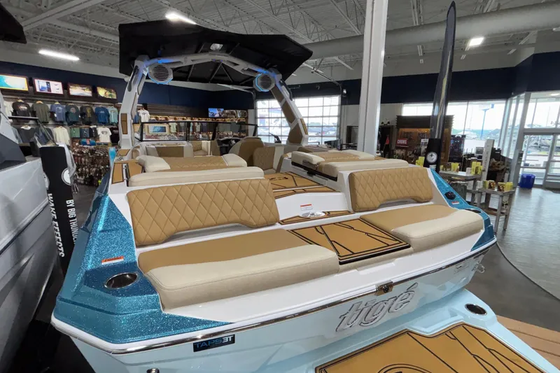 Slide: The Image of 2026 Tigé Z3 boat with luxurious seating and modern design in showroom. - 7