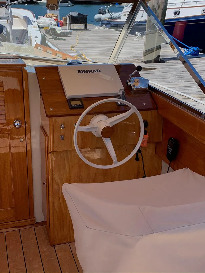 Slide: The Image of Interior of 2014 Hunt Yachts Surfhunter 25 with steering wheel and Simrad system. - 17