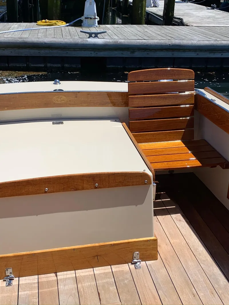 Slide: The Image of 2014 Hunt Yachts Surfhunter 25 with wooden features at the dock. - 25