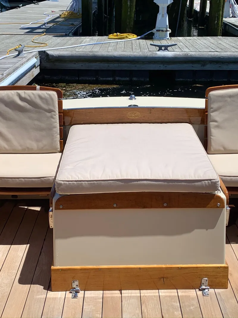 Slide: The Image of 2014 Hunt Yachts Surfhunter 25 with cushioned seating at the dock. - 27