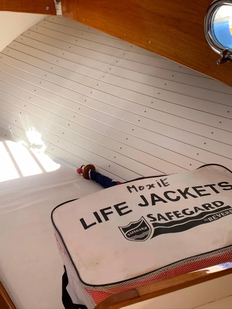 Slide: The Image of Interior of Hunt Yachts Surfhunter 25 with life jackets, year 2014. - 35