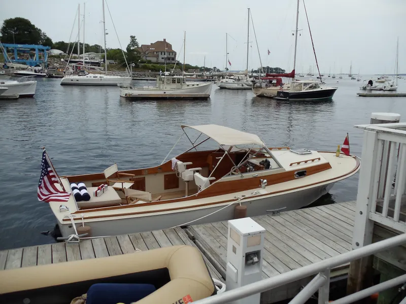 Slide: The Image of 2014 Hunt Yachts Surfhunter 25 docked in marina, surrounded by sailboats. - 4