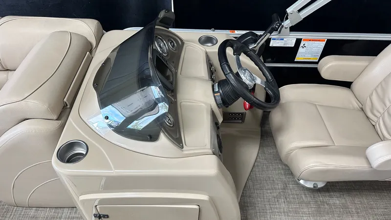Slide: The Image of Interior of 2016 G3 SUNCATCHER X324SS boat with steering console. - 39