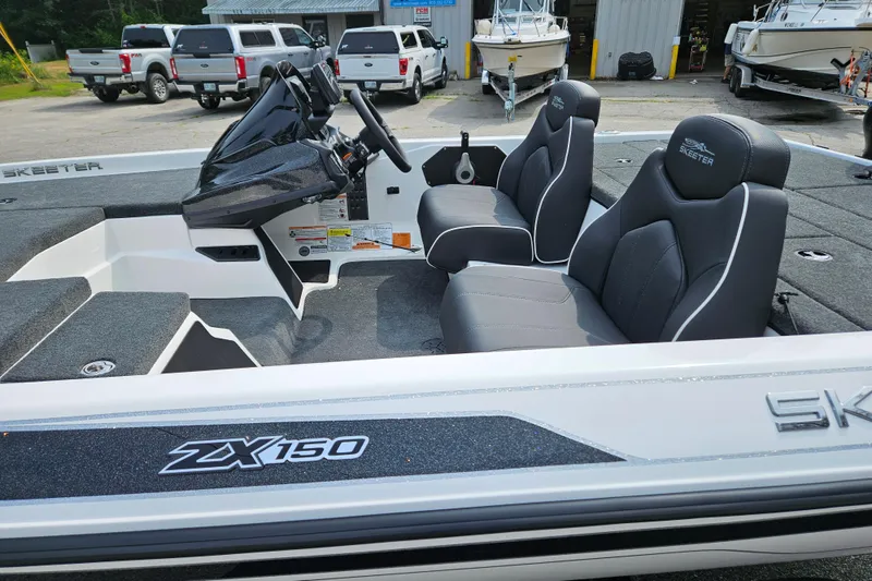 Slide: The Image of 2026 Skeeter ZX150 boat interior with sleek seating and modern dashboard. - 4