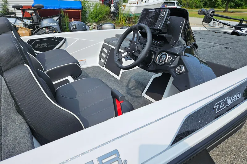 Slide: The Image of 2026 Skeeter ZX150 boat interior with modern dashboard and seating. - 5