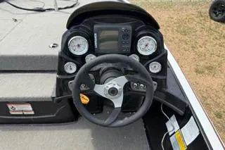 Slide: The Image of 2013 Nitro Z-6 boat dashboard with steering wheel and gauges. - 7