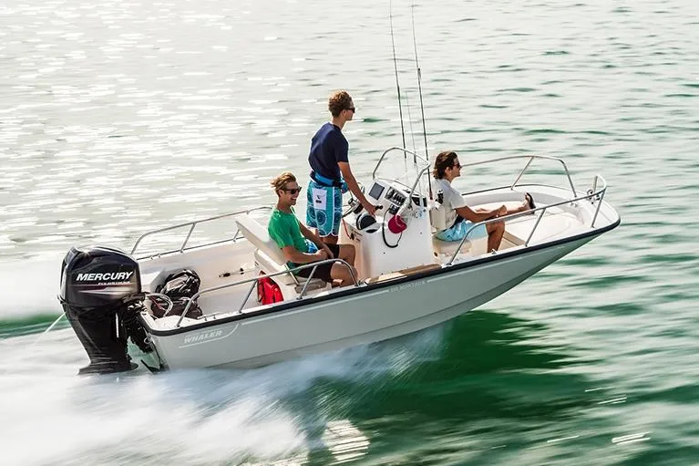 The Image of Manufacturer Provided Image: 2026 Boston Whaler 150 Montauk boat cruising with three people on a sunny day. - 0