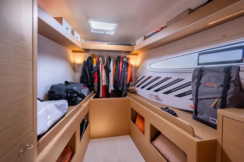 Slide: The Image of Manufacturer Provided Image: Luxurious interior of 2026 Excess 14 yacht with modern storage and clothing area. - 12