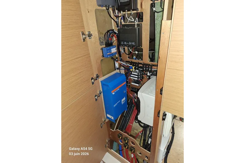 Slide: The Image of Electrical panel inside Excess 14 model, showcasing wiring and components, 2026. - 29