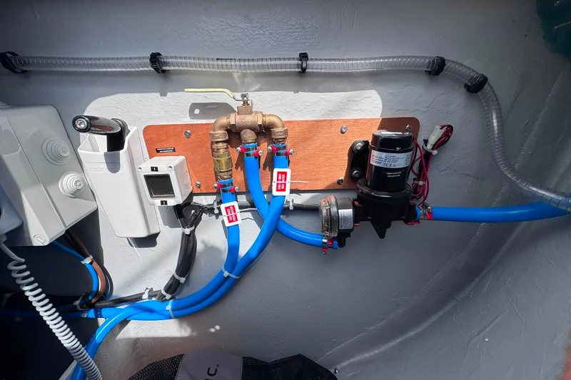 Slide: The Image of Boat plumbing system with blue pipes and pump, Excess 14 model, 2026. - 47