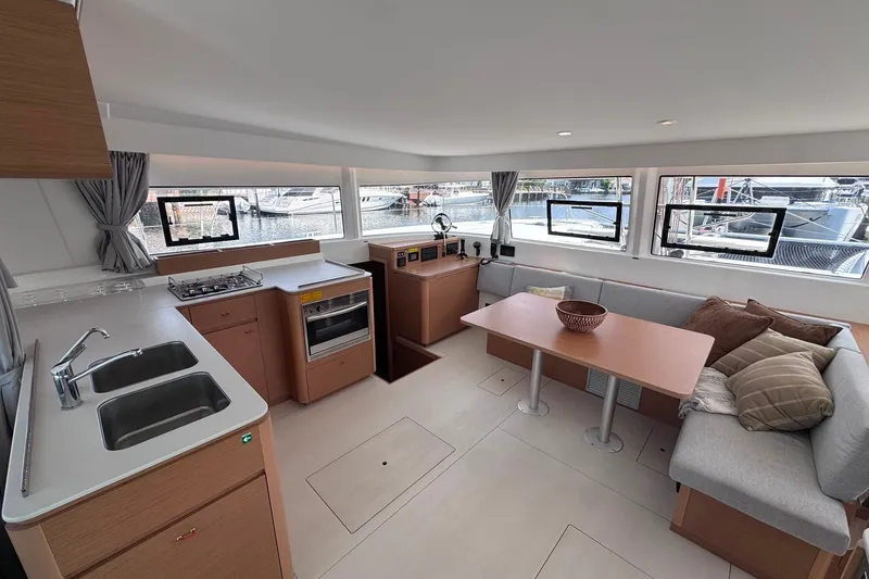 Slide: The Image of Modern interior of 2026 Excess 14 catamaran with kitchen and seating area. - 51
