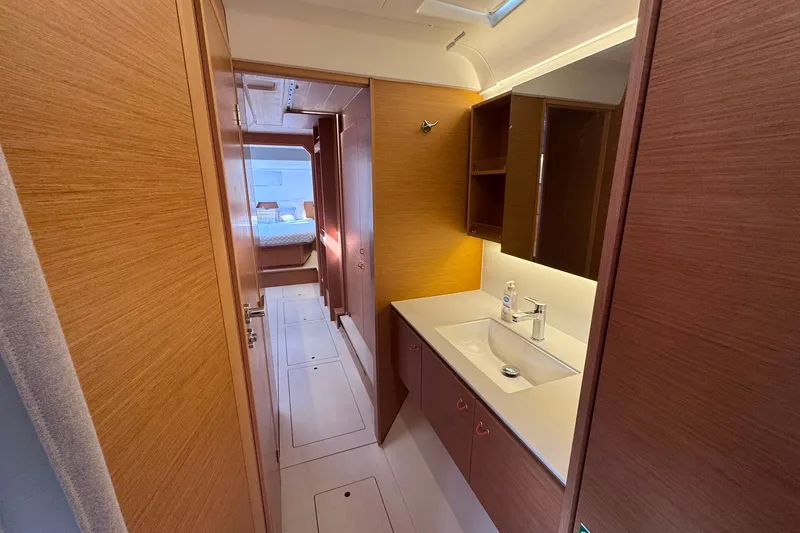 Slide: The Image of Luxurious interior of 2026 Excess 14 yacht featuring modern bathroom and hallway design. - 69