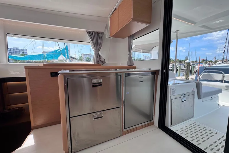 Slide: The Image of Modern interior of 2026 Excess 14 yacht with sleek kitchen and marina view. - 52