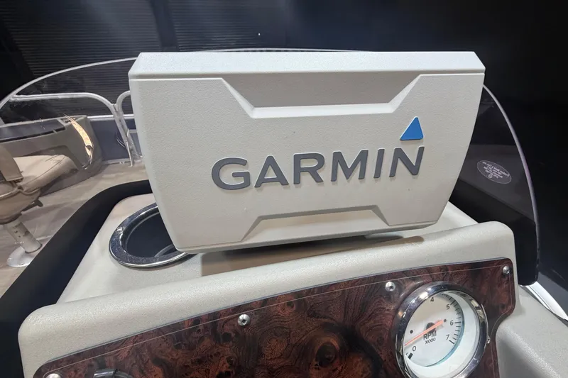 Slide: The Image of Garmin device on 2023 Sun Tracker Bass Buggy 18 DLX dashboard, featuring RPM gauge. - 13